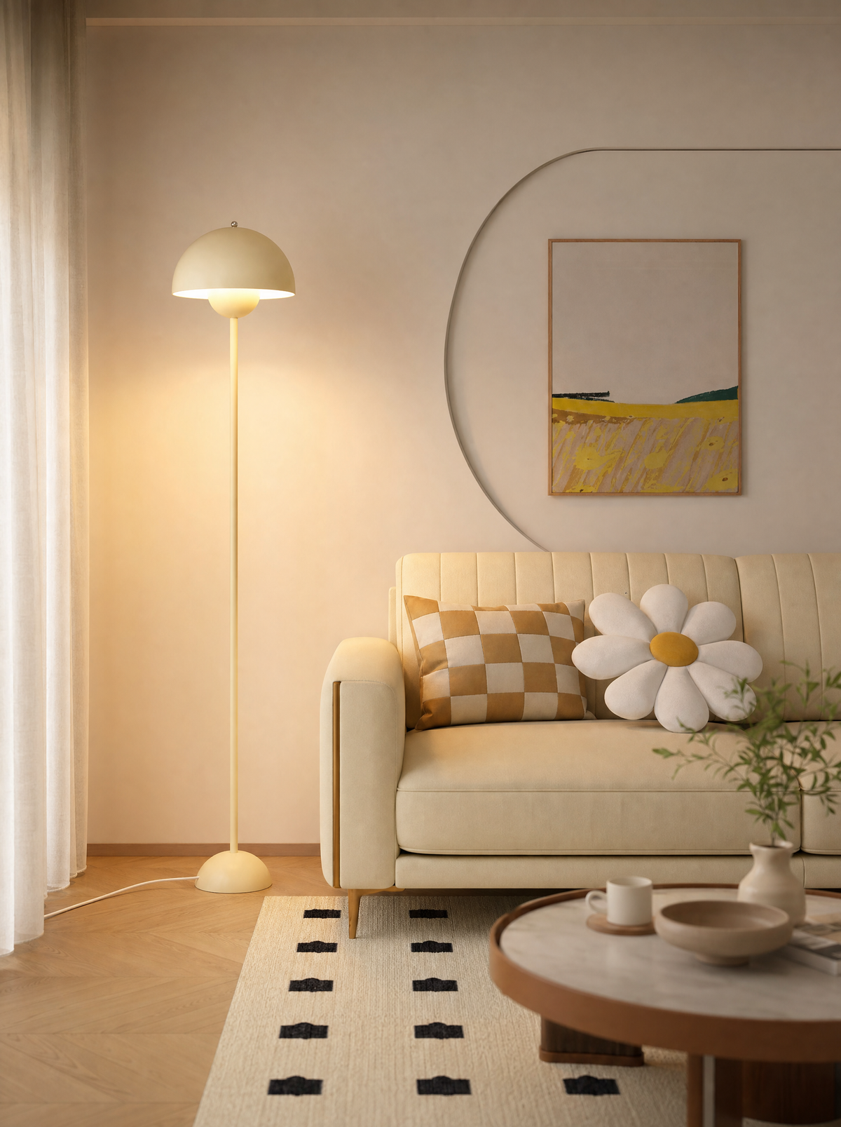 Crema cream floor lamp glowing beside a sofa in a living room